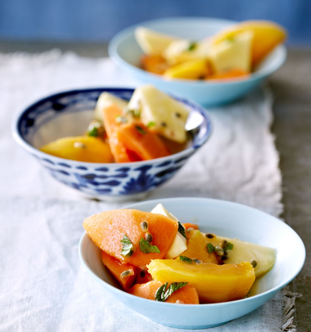 Tropical fruit salad with mint and passion syrup