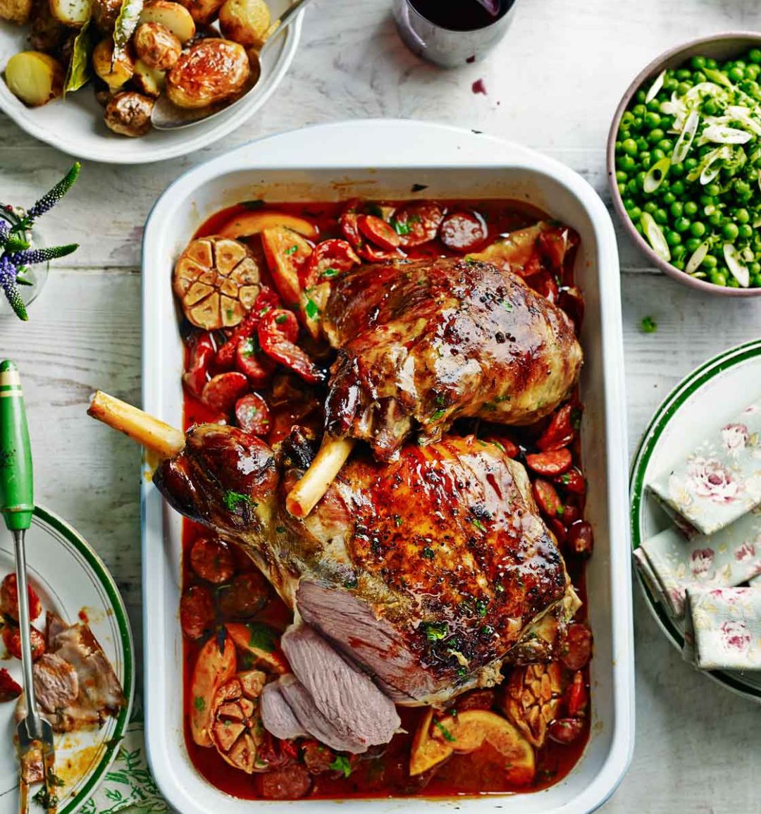 Roast lamb with chorizo, orange and parsley and simple roasties  