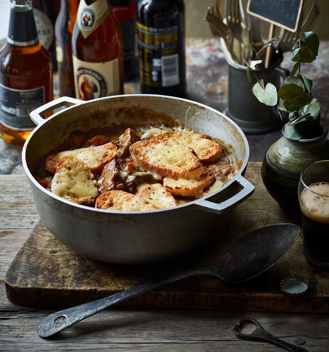 Beef and ale stew with cheese and mustard croûtes