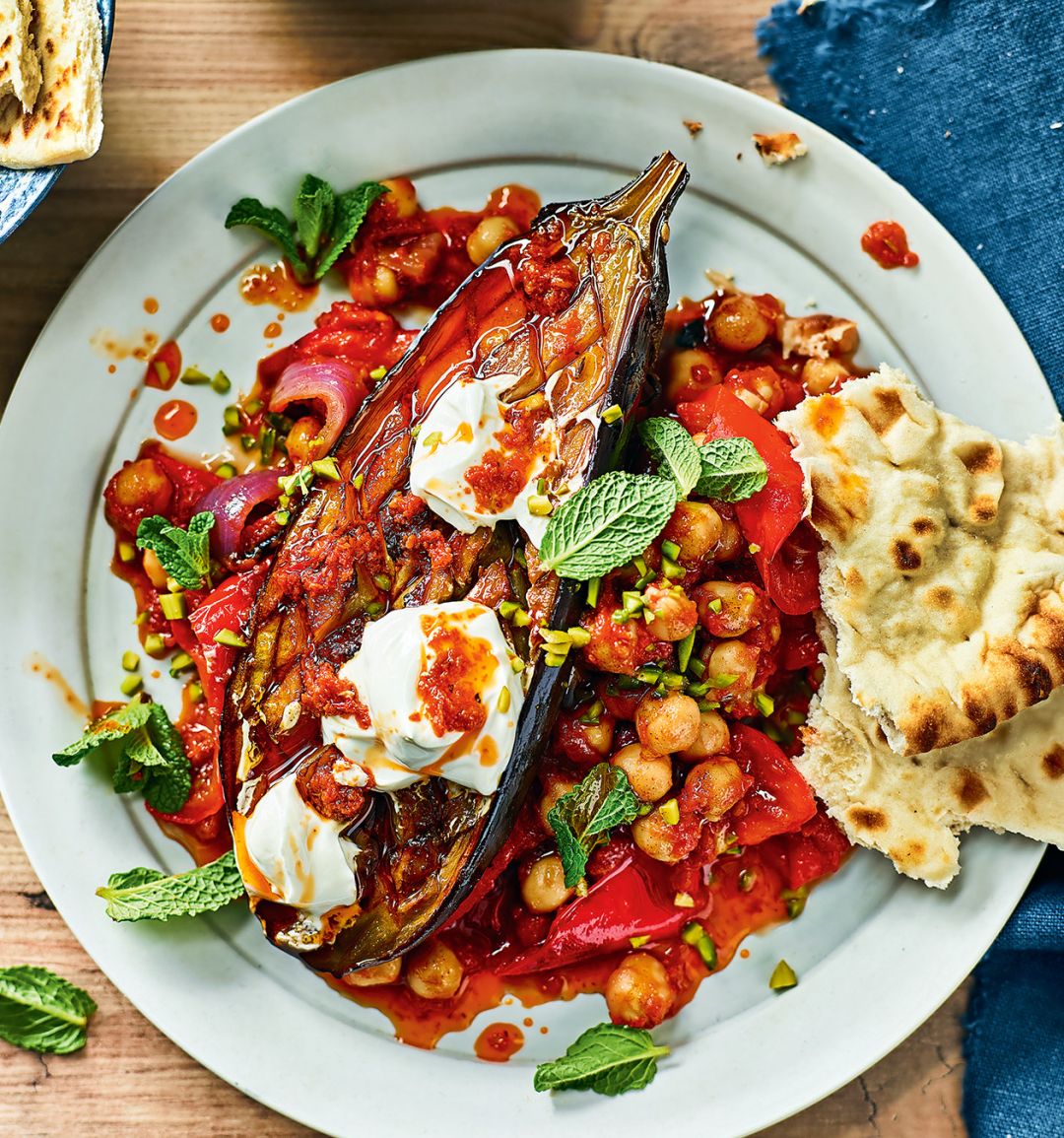 Roasted harissa aubergines with tomato, red pepper and chickpea stew