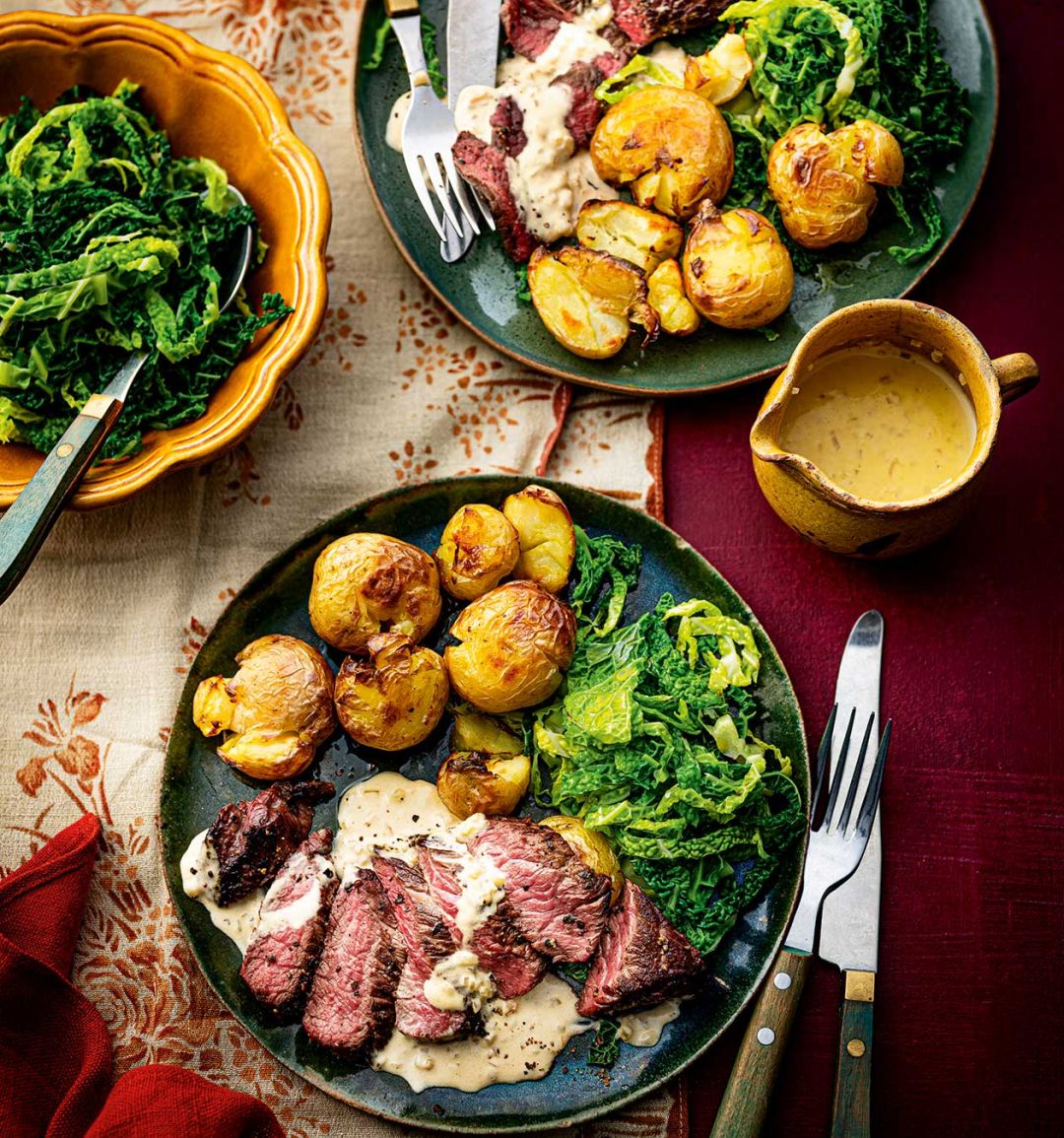 Peppered venison steak with whisky sauce and roasties