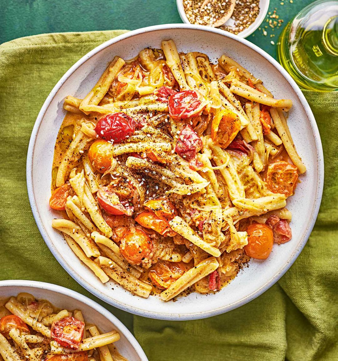 Burst tomato, caramelised onion and tahini pasta