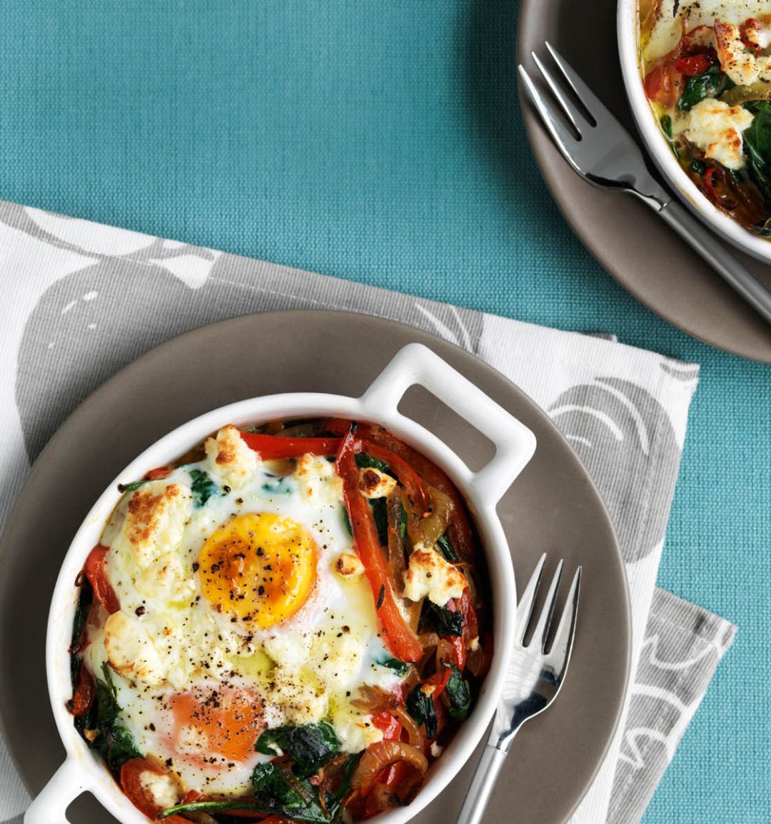 Baked eggs with spicy peppers, spinach and feta