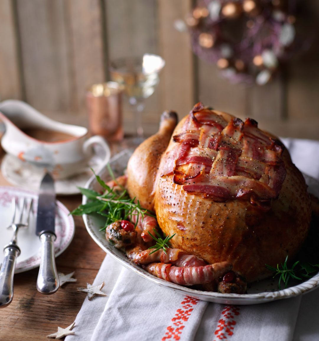 Roast turkey with cranberry stuffing and pigs in blankets