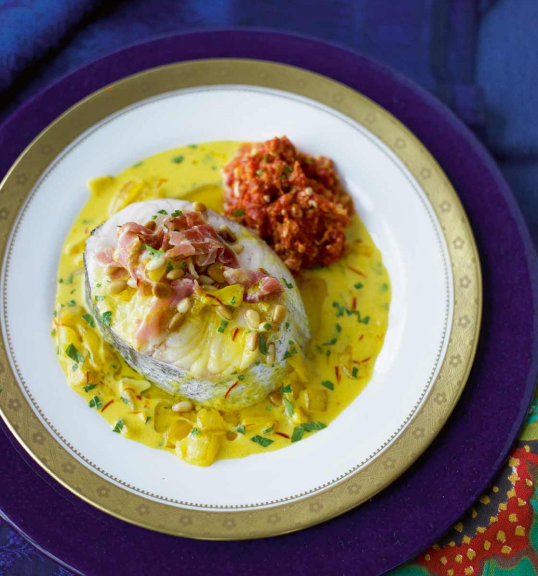 Hake with Serrano ham and roasted pepper sauce