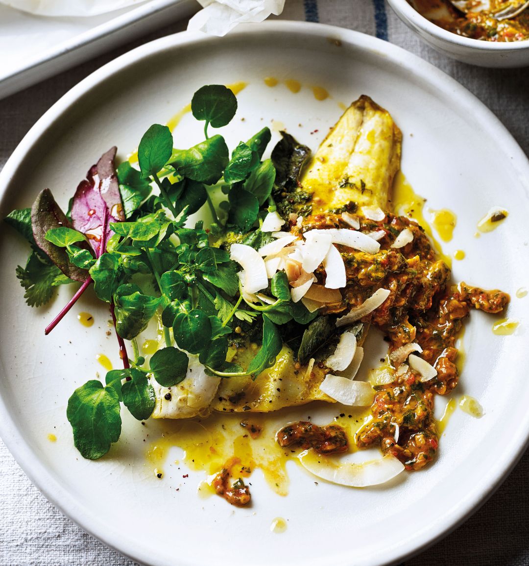 Herb-crusted sea bass with toasted coconut and tomato dressing
