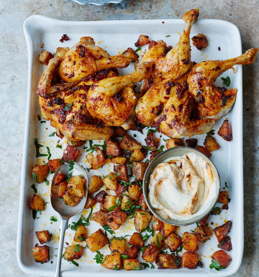 Spiced poussins with roasties
