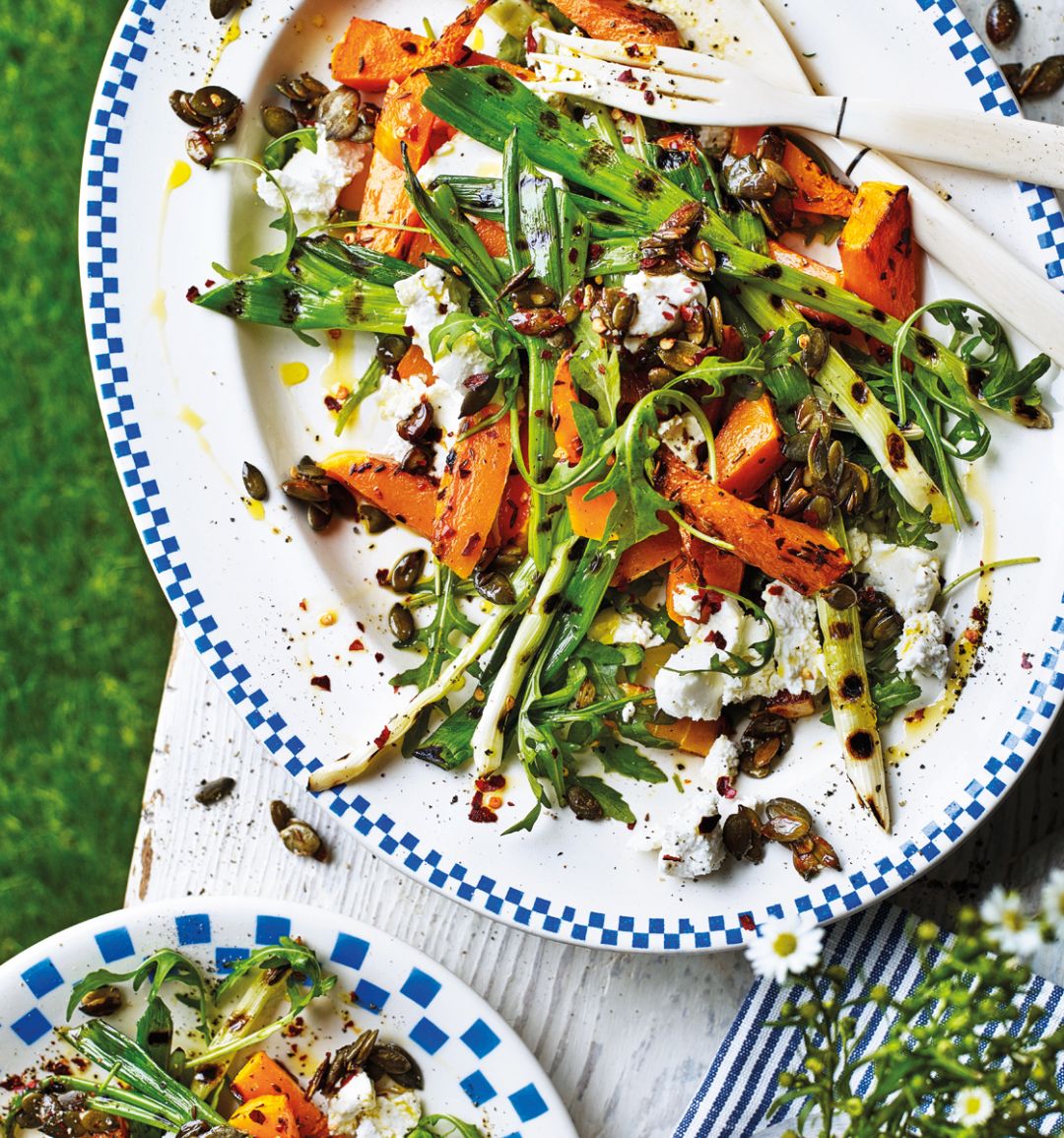 Warm squash and goats’ cheese salad with pumpkin seed crunch