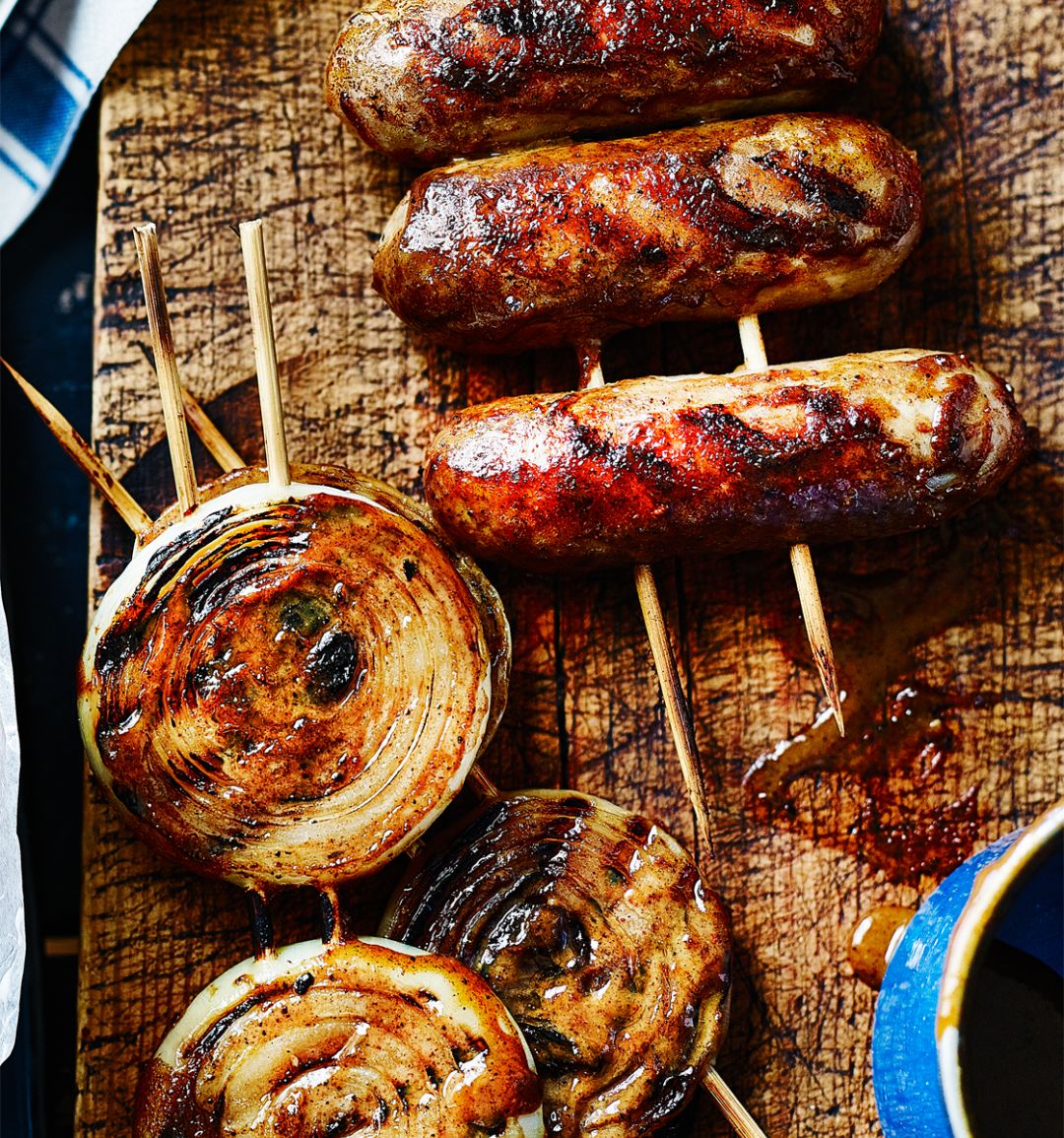 Sticky glazed sausages and onion rings