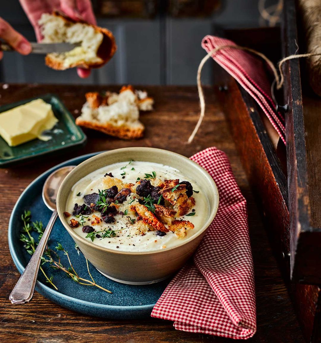 Maple-roasted celeriac and parsnip soup with black pudding crumbs 