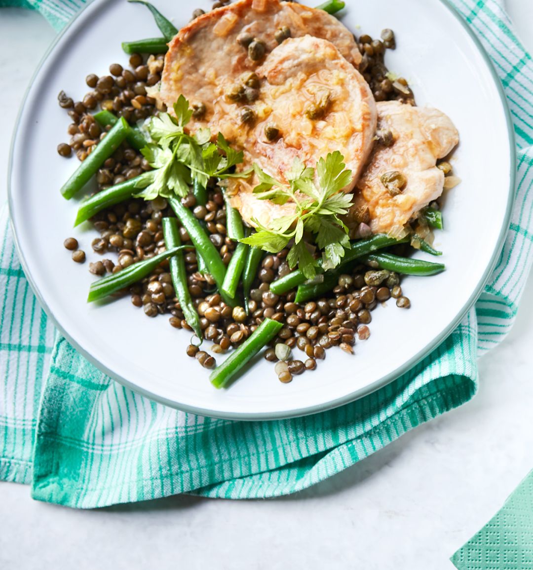 Pork with caper lemon sauce and green bean lentils