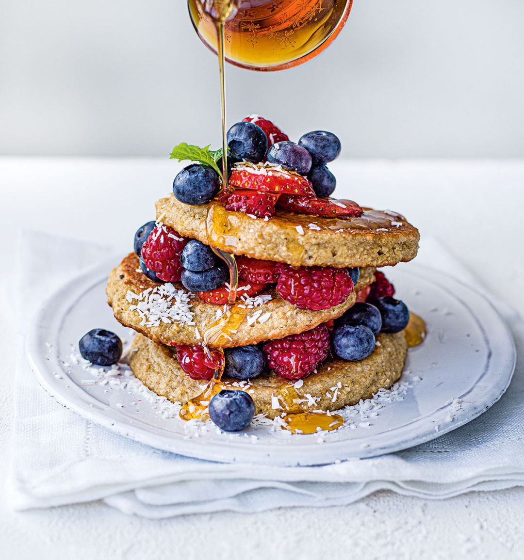 Gluten-free oat pancakes with berries 