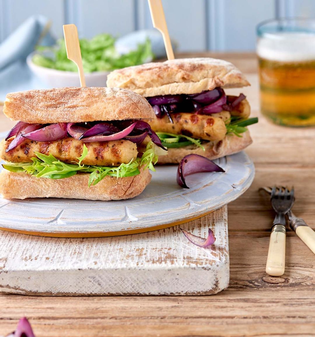 Sponsored: BBQ Little Willies Sausage burgers with caramelised onions