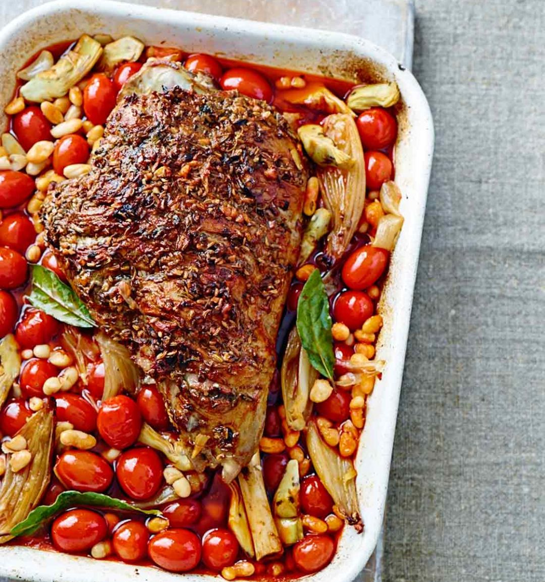 Slow-cooked spiced leg of lamb with artichokes, tomatoes and beans 