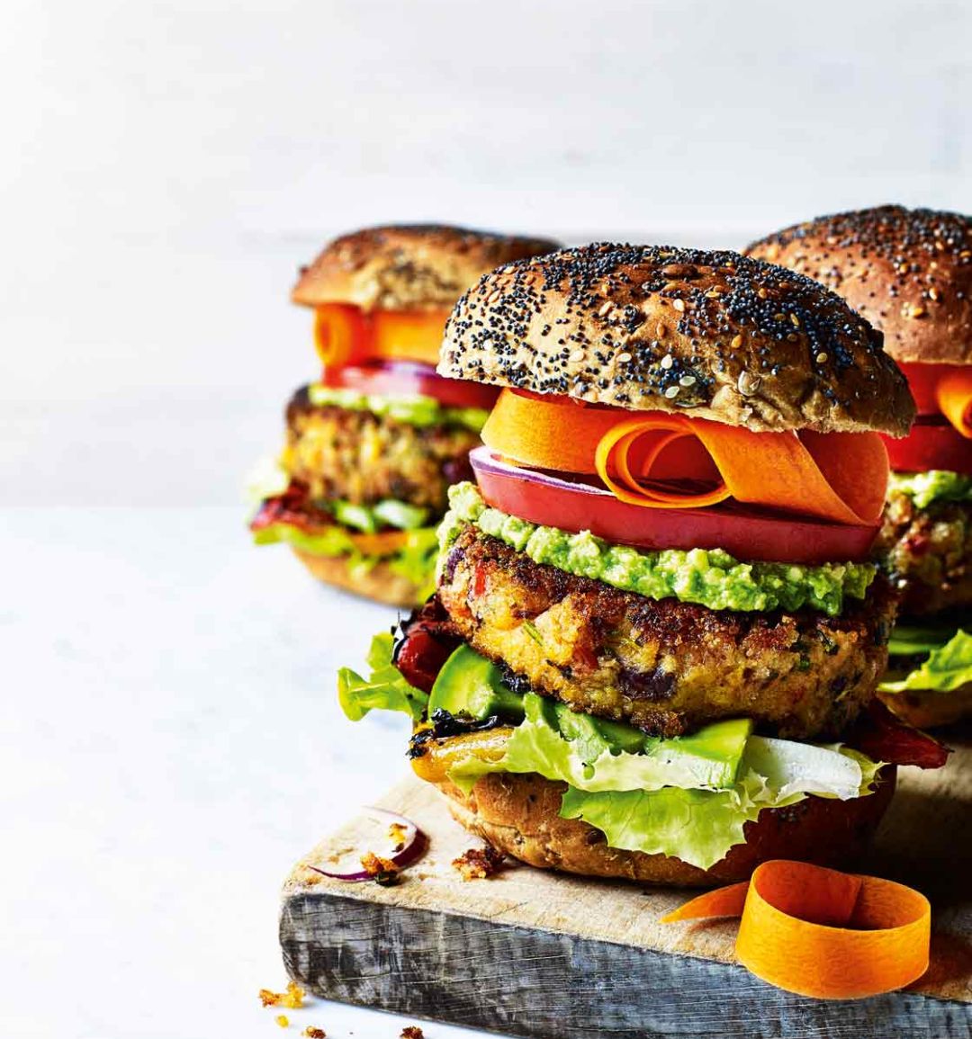 Stacked sweet potato burgers with avocado lime cream