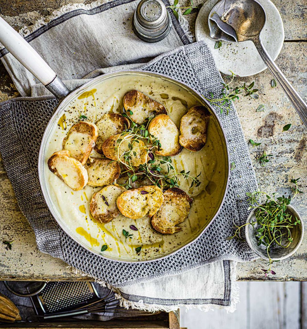 Cauliflower cheese soup with cheese toastie topping