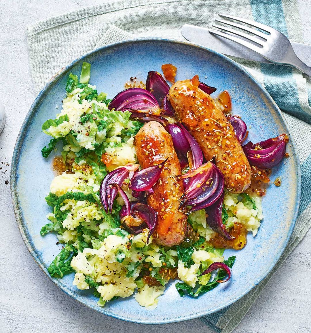Marmalade sausages with parsnip colcannon