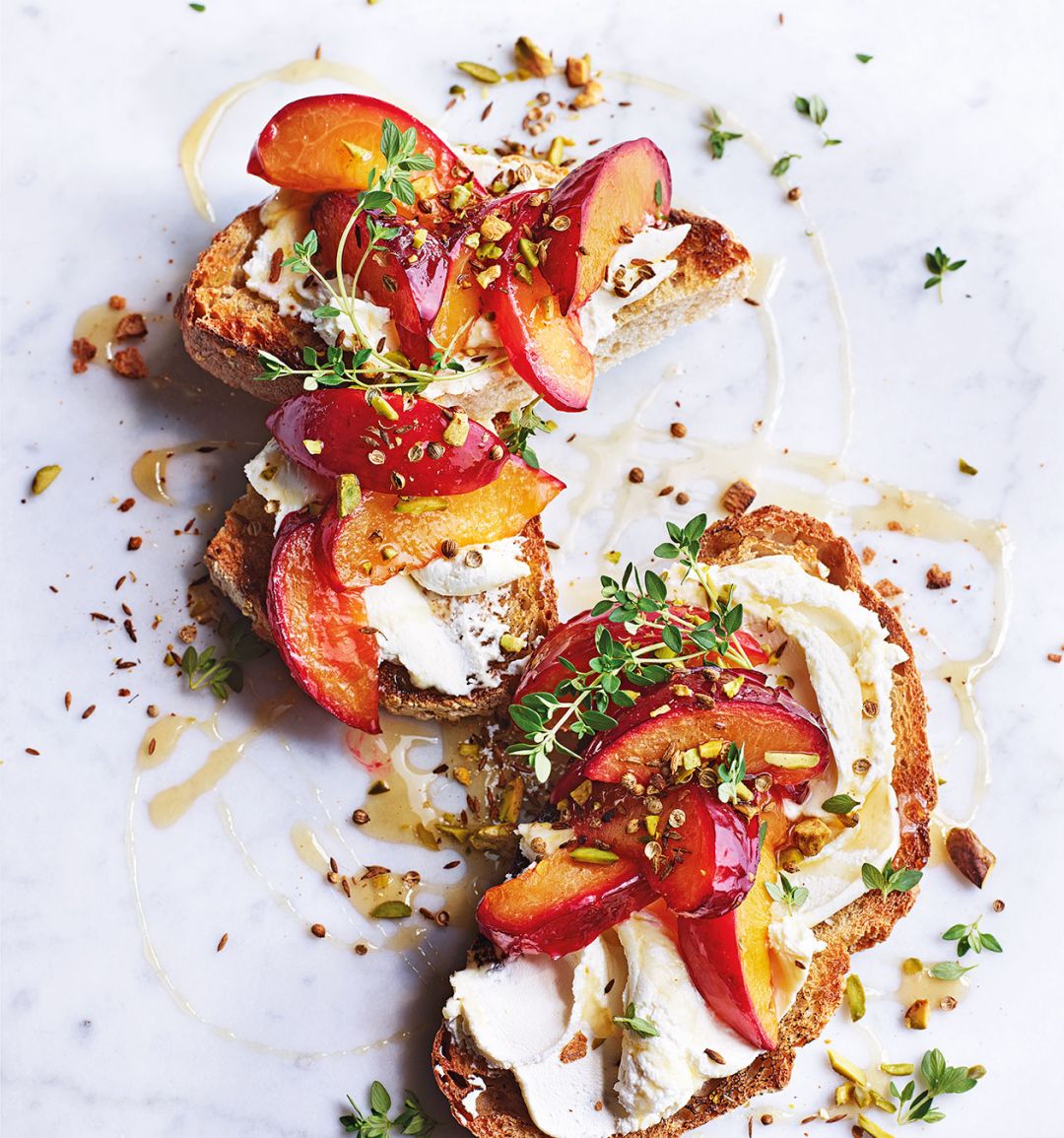 Creamy cheese toast with roast plums and pistachio dukkah