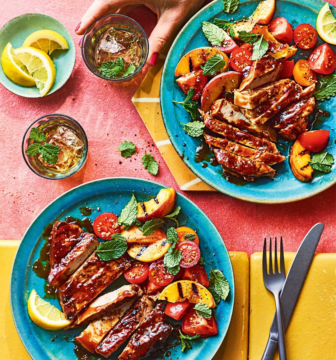 Bourbon-glazed pork chops with grilled peach and tomato salad