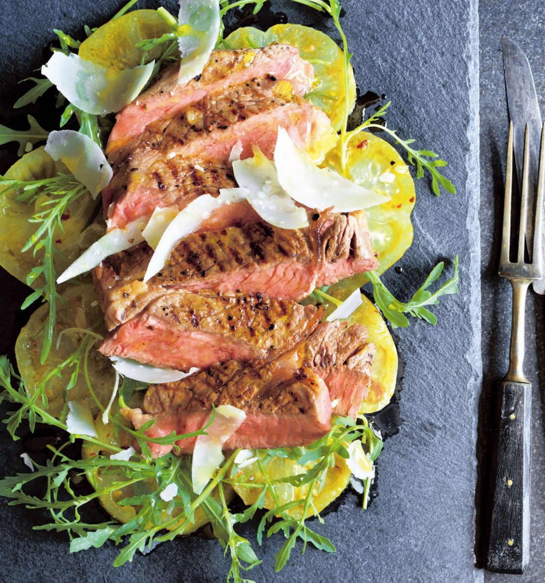 Steak tagliata with yellow tomatoes, oregano and mustard