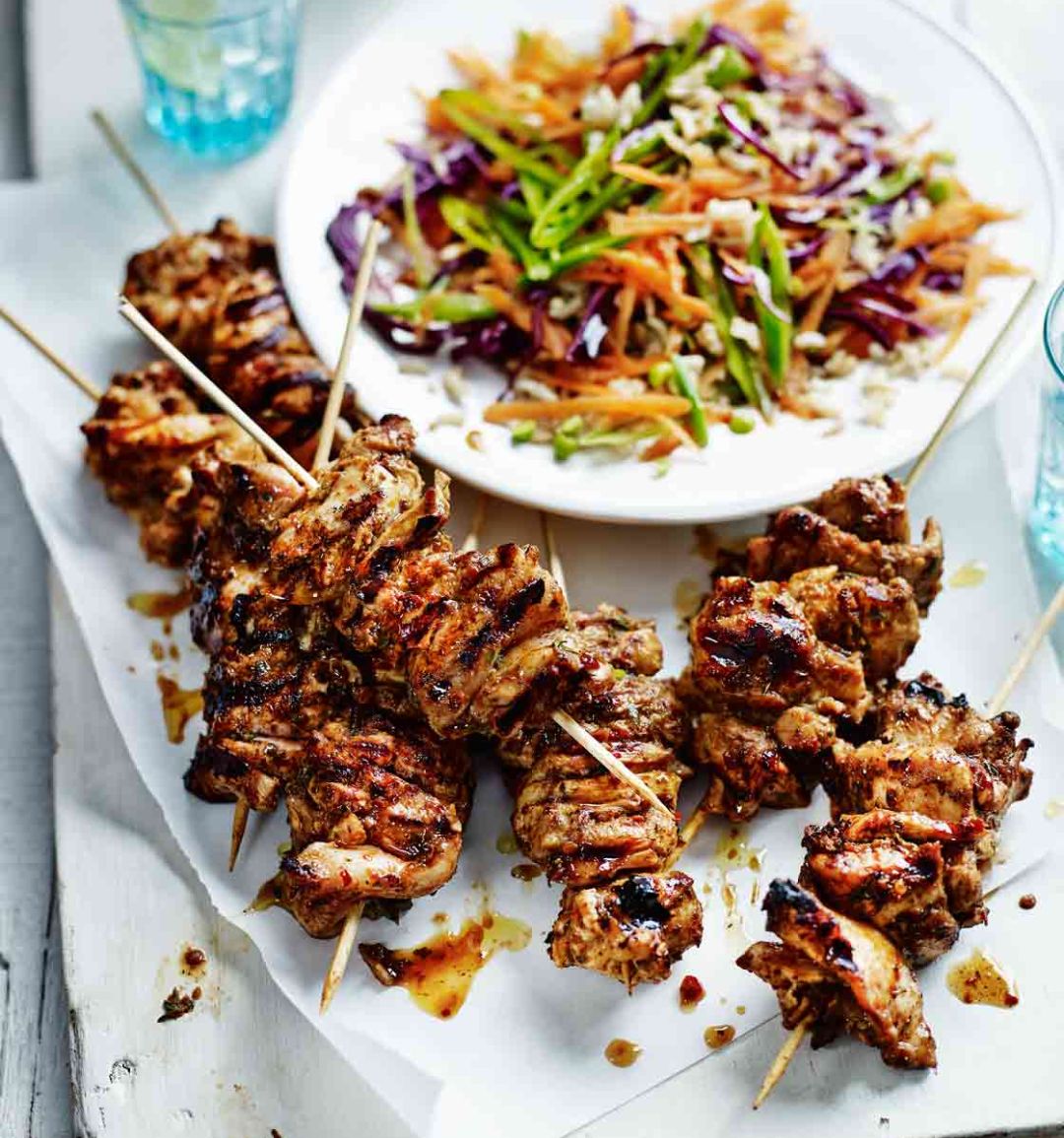 Spicy jerk chicken skewers with brown rice slaw