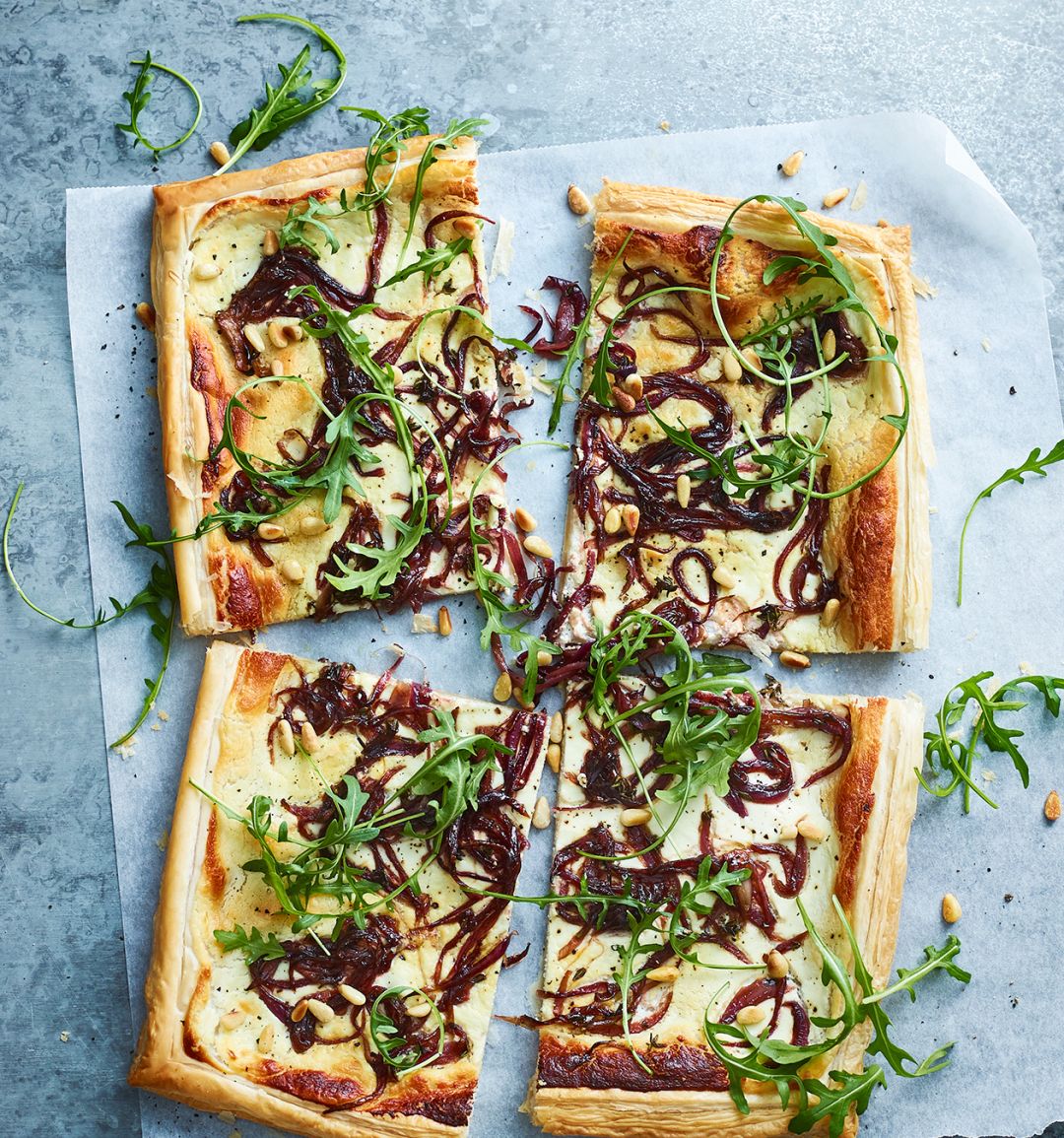 Balsamic onion, goats' cheese and rocket tart