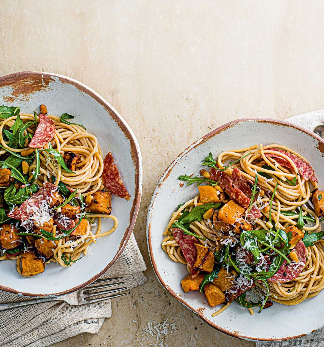 Wholewheat spaghetti with squash, salami and pine nuts