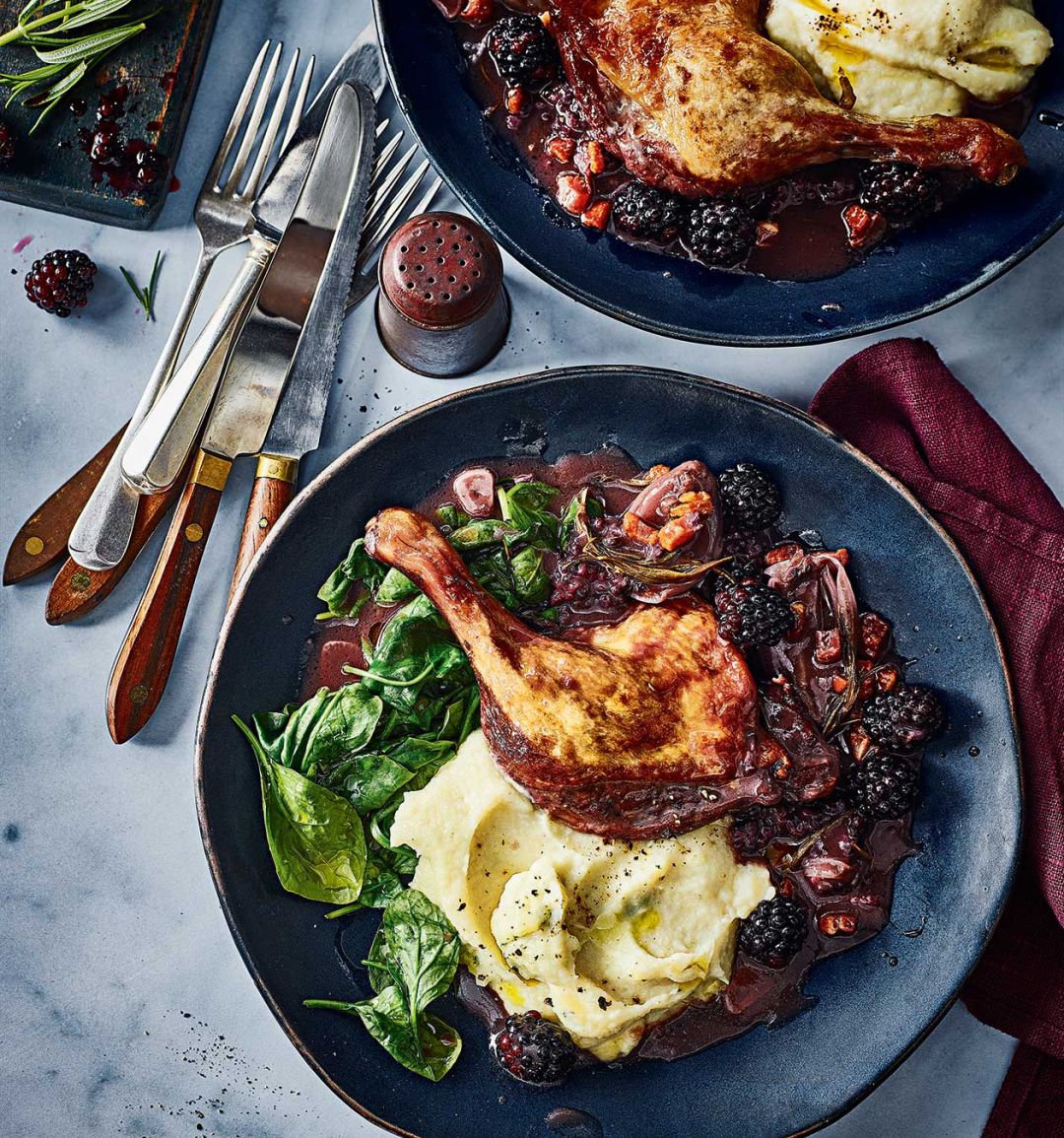 Braised duck legs with blackberries and celeriac mash
