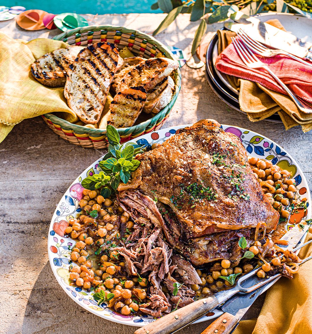 Braised shoulder of lamb with chickpeas, onions, garlic and oregano