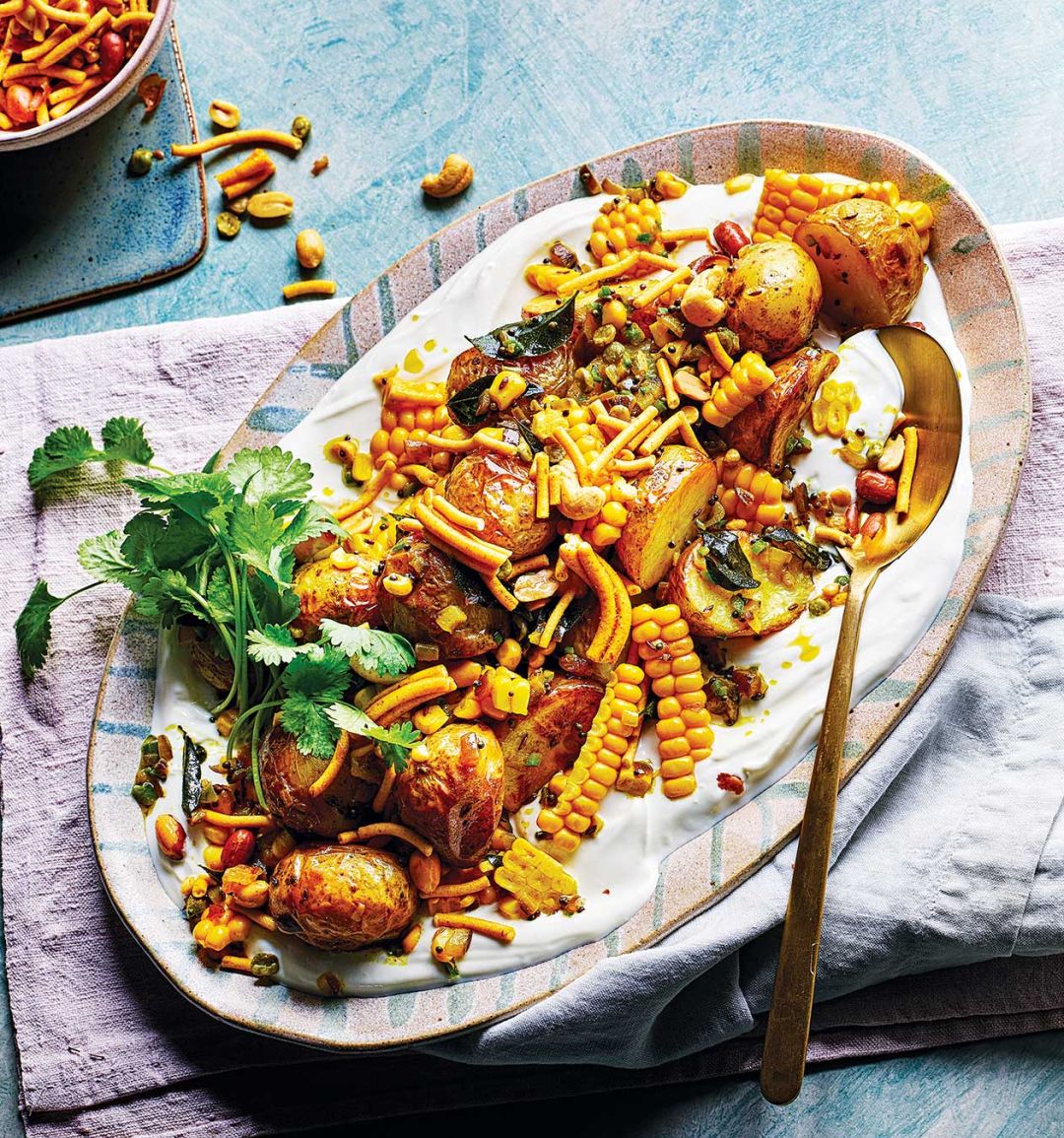 Roast jersey royals and curry leaf sweetcorn with ginger yogurt