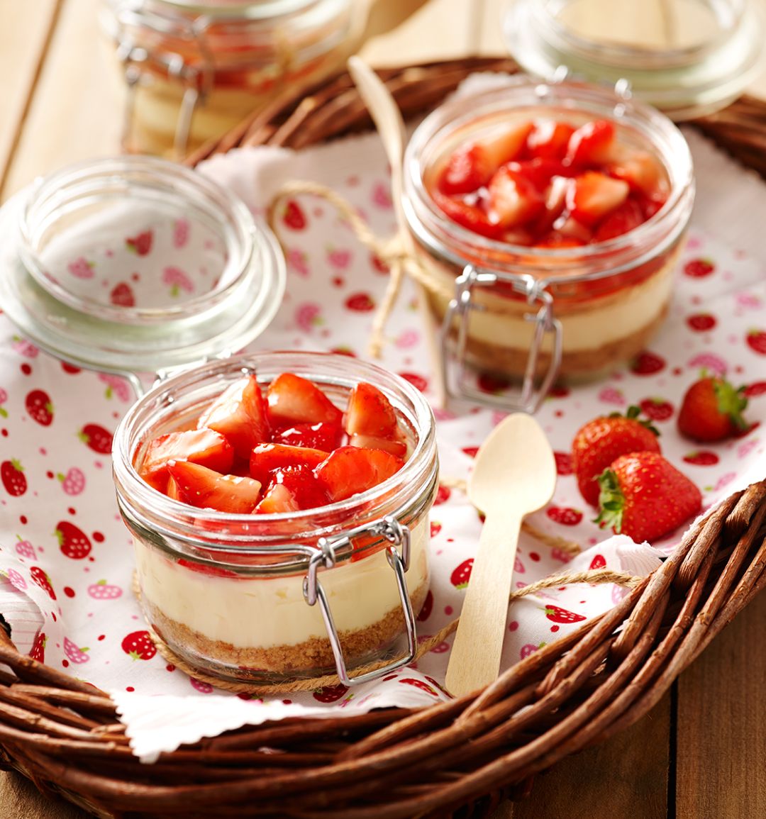 Individual strawberry and cream cheesecakes