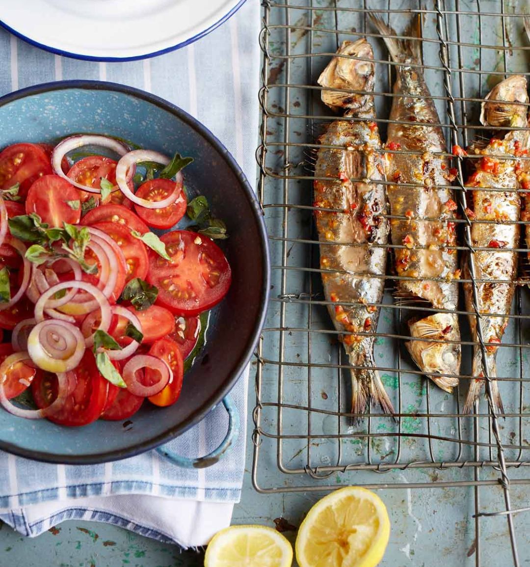Barbecued piri piri sardines with tomato and onion salad