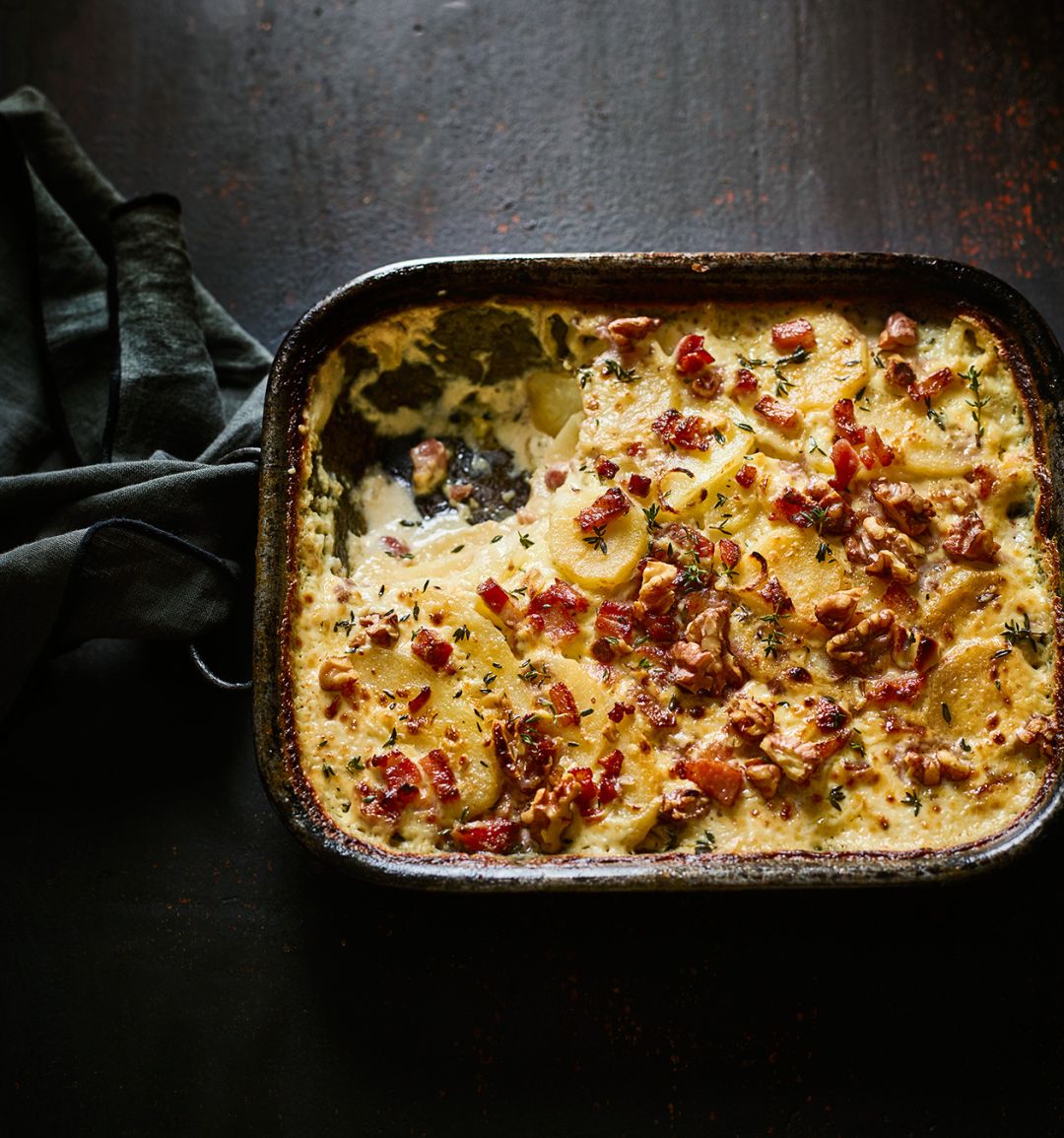 Potato and parsnip gratin with bacon and walnuts