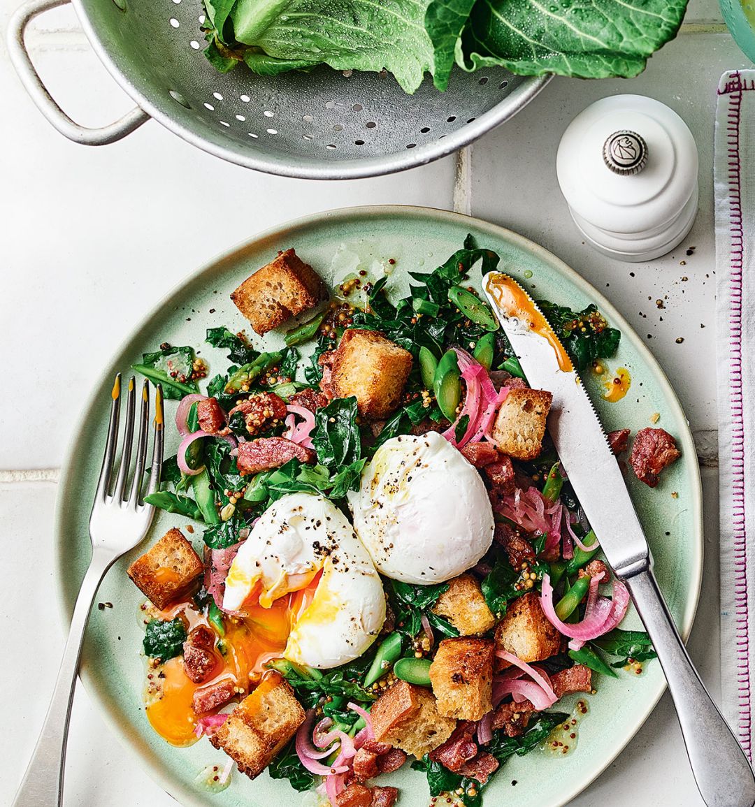 Warm spring greens salad with poached eggs and bacon-fat breadcrumbs