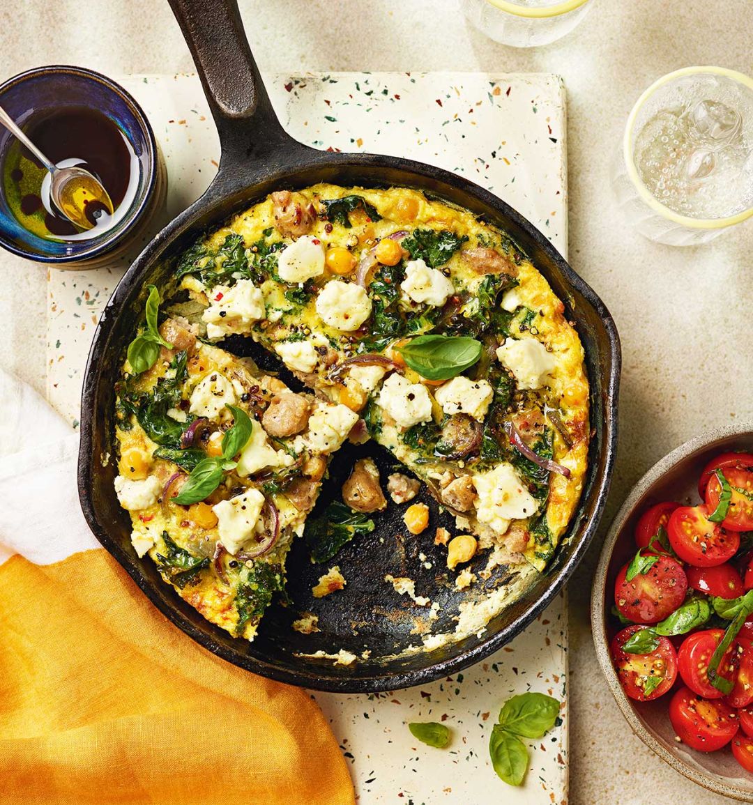 Sausage, chickpea and kale frittata with tomato salad