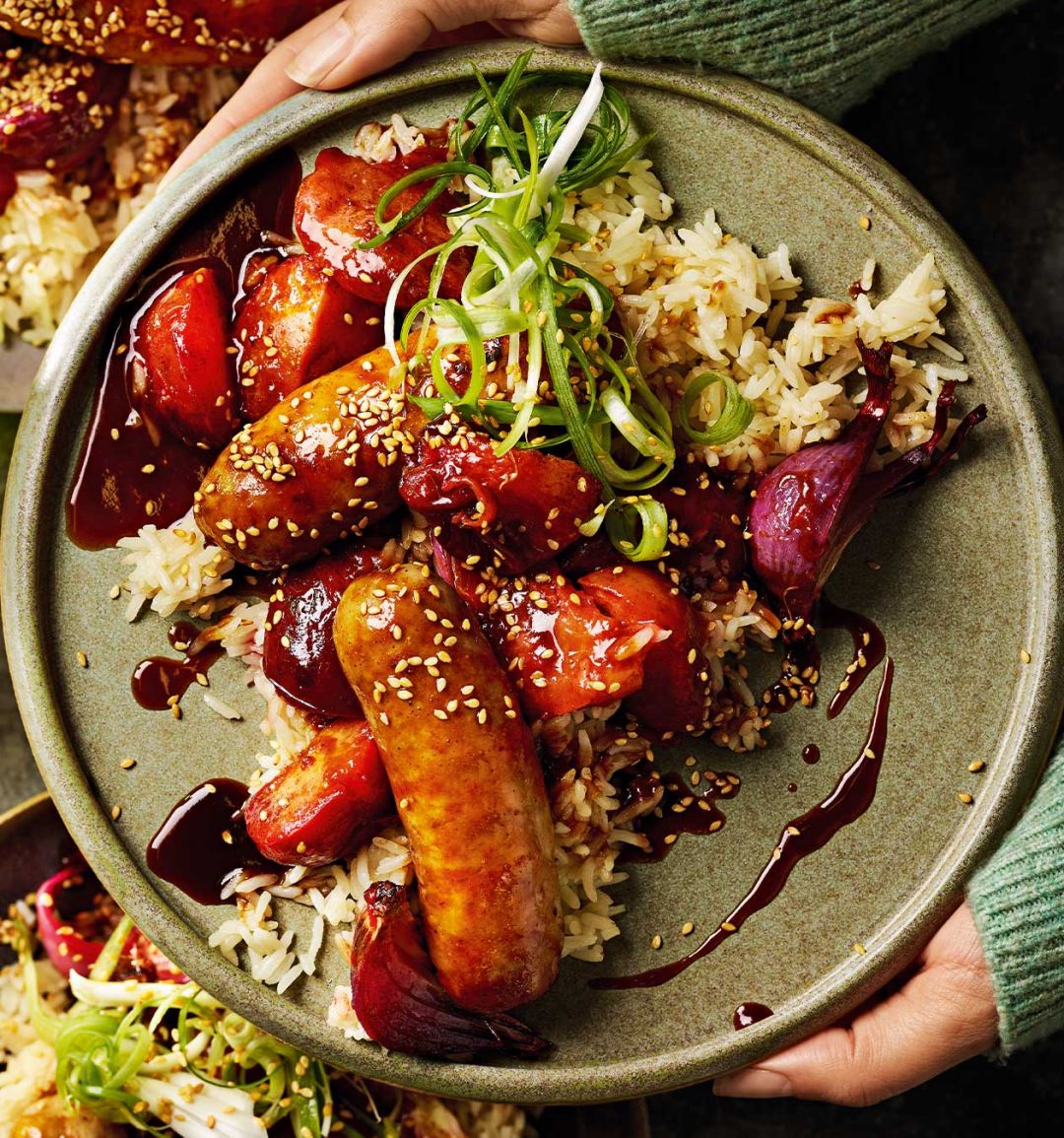Five-spice sausages with sticky plums