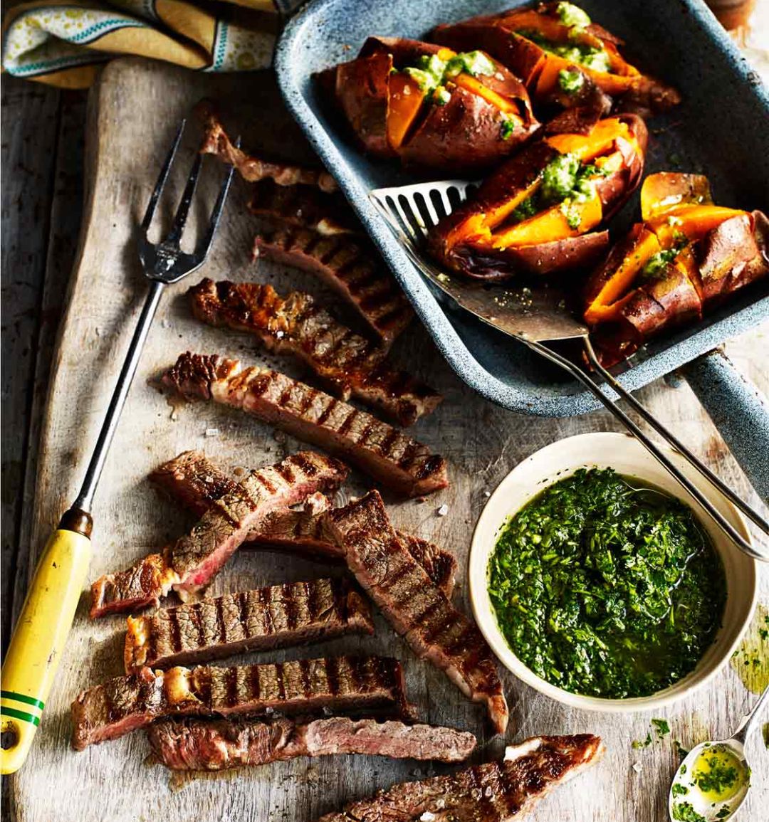 Steaks with chimichurri salsa and baked sweet potatoes