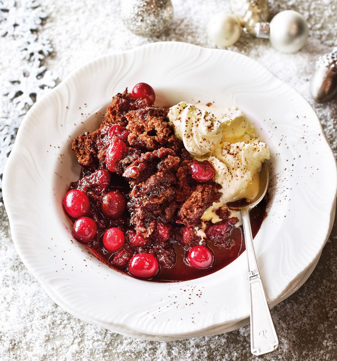 Self-saucing chocolate cranberry pudding with cinnamon cream