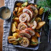 Sage and apricot-stuffed pork tenderloin with roasted pear, parsnip and potato