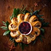 Sausage roll wreath with mulled wine cranberry relish