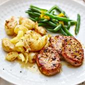 Citrus pepper pork with crushed potatoes