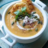 Carrot, ginger and parsley soup with mini feta fritters and pumpkin seeds