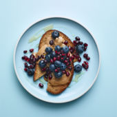 Nut butter on toast with blueberries and pomegranate
