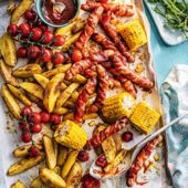 Smoky pigs-in-blankets traybake