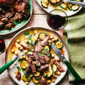 Slow-cooked lamb shoulder with vermouth-braised courgettes