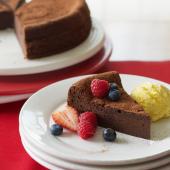 Chocolate brownie cake with berries and ice cream