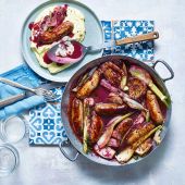 Wine-braised sausages with olive oil mash