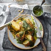 Whole roast celeriac with sage and walnut pesto