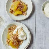 Baked plums with cardamom and honey, oat crumble and whipped cream