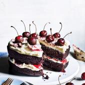 Vegan chocolate and cherry layer cake with vanilla frosting